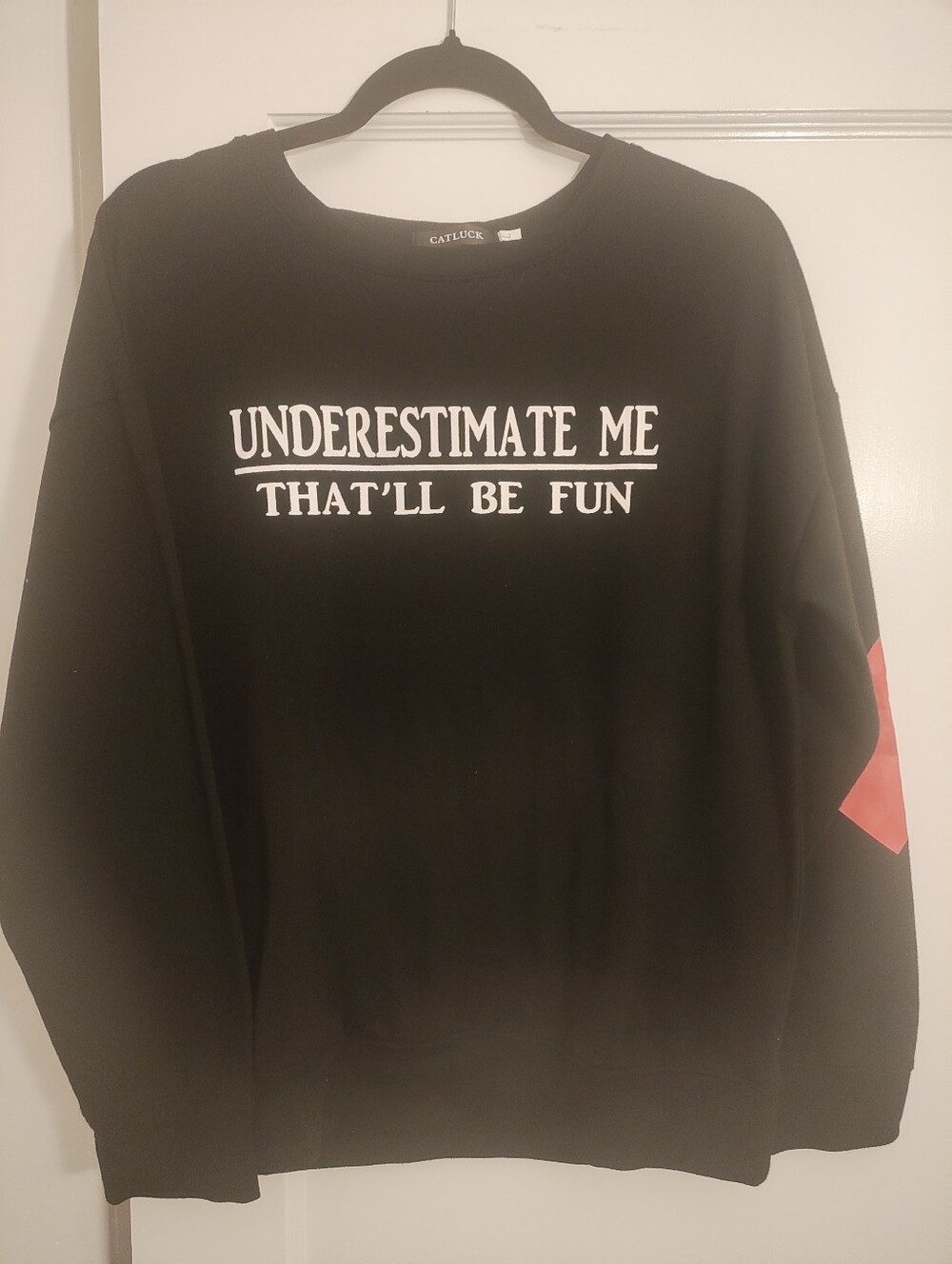 CATLUCK Women’s Large Black Graphic Long Sleeve Top Underestimate Me Elbow Patch